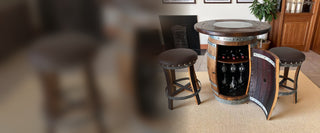 Handcrafted Wine Barrel bar cabinet with a wood-glass top and two bar stools by the fireplace